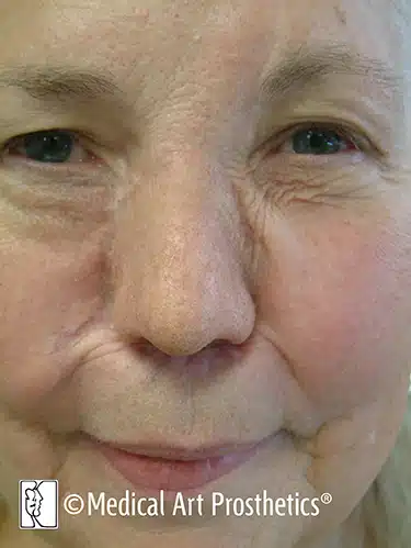 A close up of an older woman 's face
