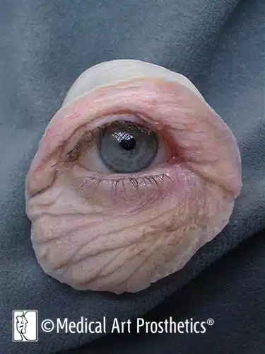 A close up of an eye with wrinkles on it