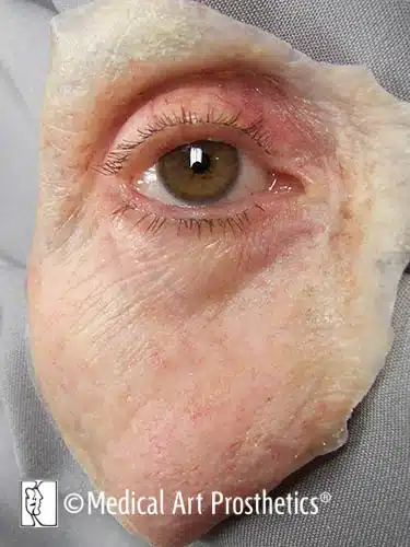 A close up of an old person 's eye